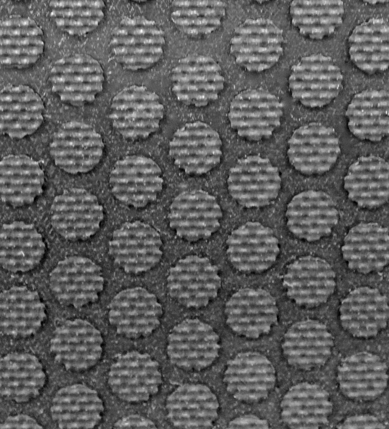 Textura rascadora de la superficie del felpudo de caucho
